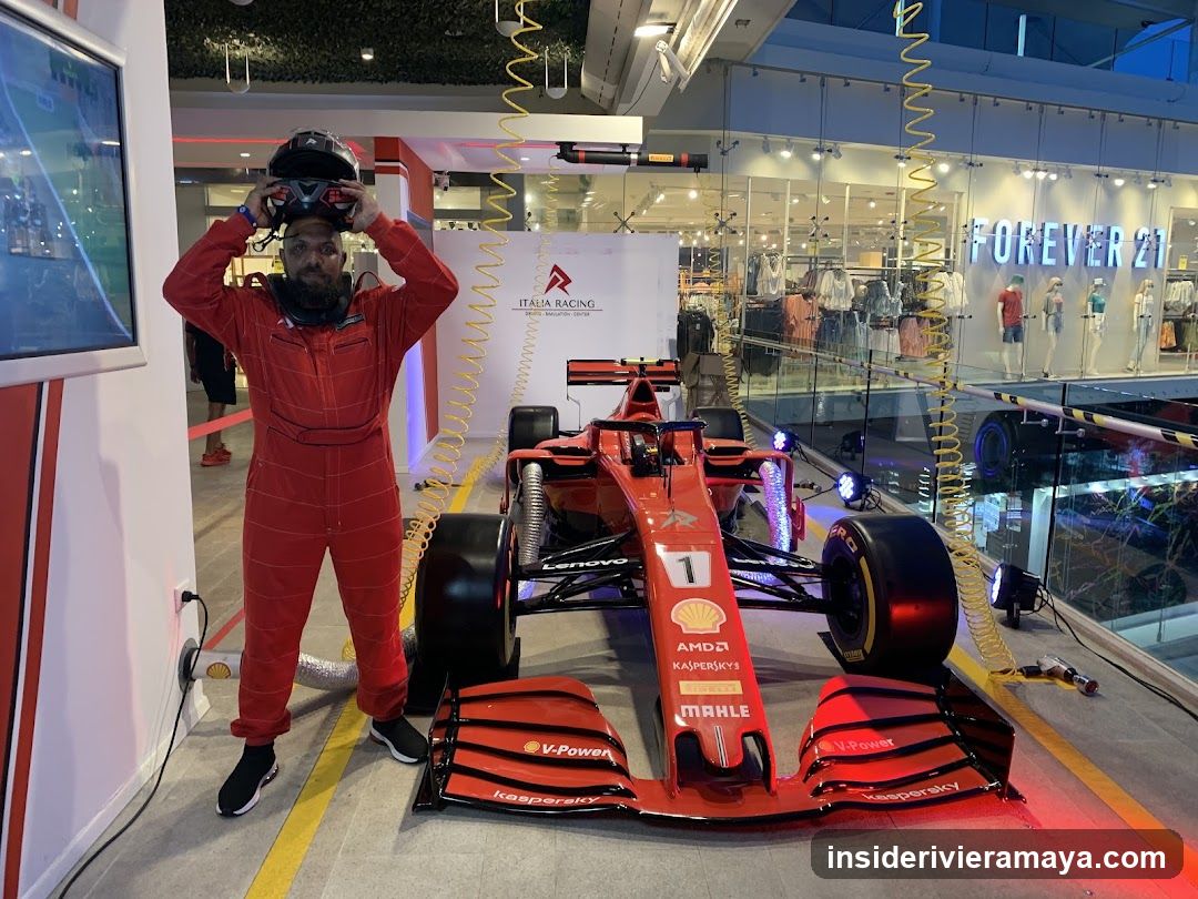 Man in racing suit with Formula 1 car