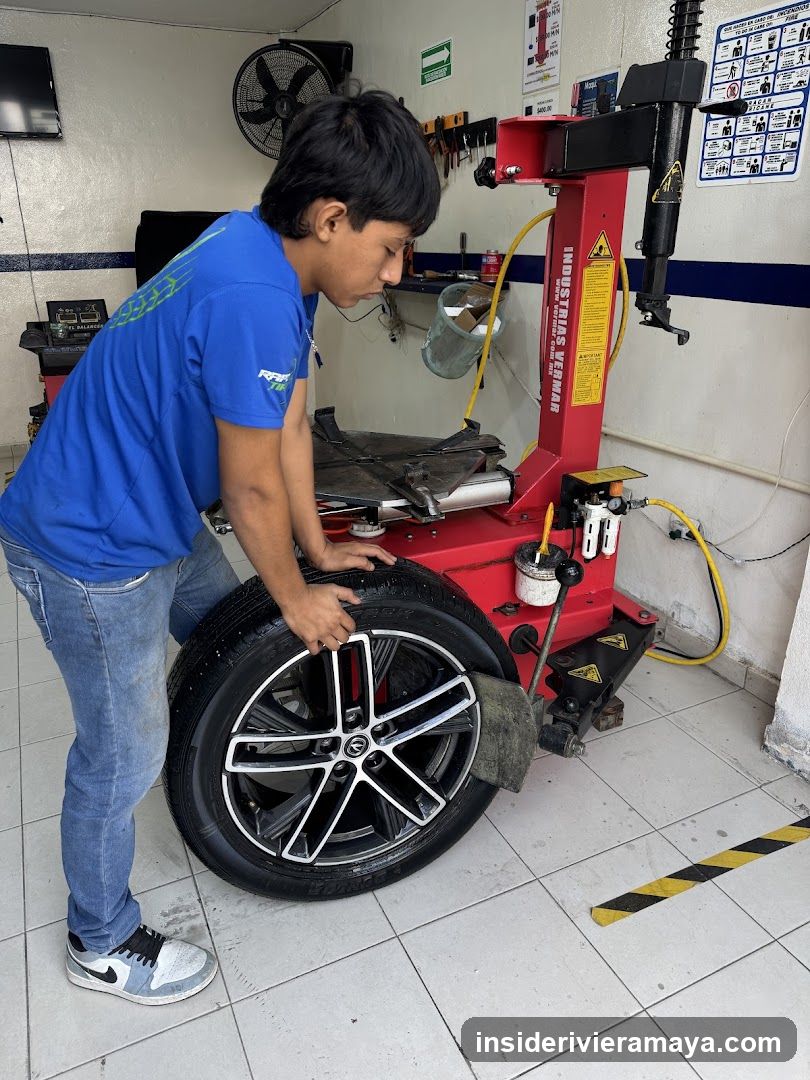 Technician operating tire machine
