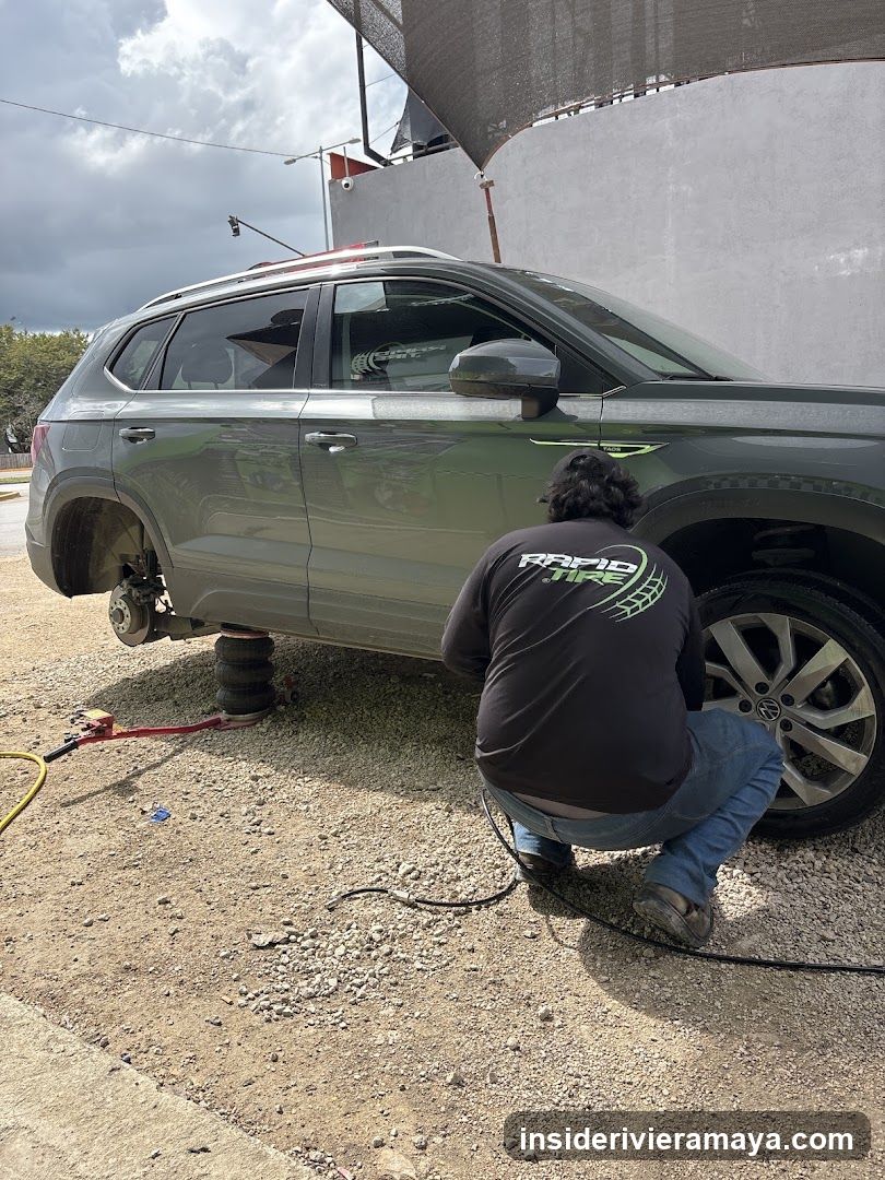 Mechanic working on SUV