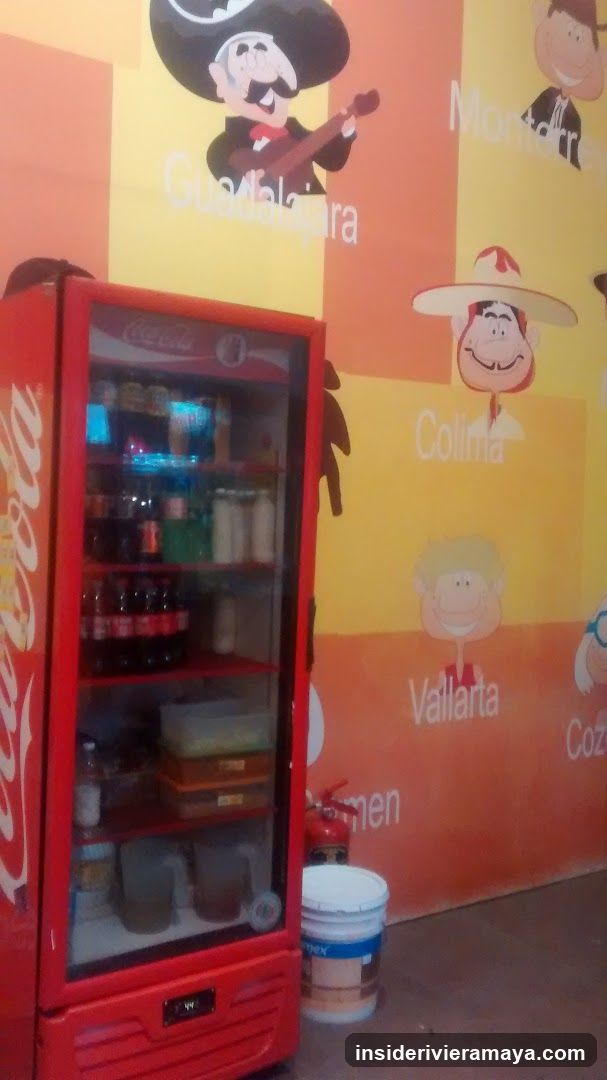 Red Coca-Cola Refrigerator and Mural