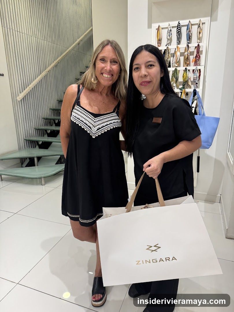Two women posing with shopping bags